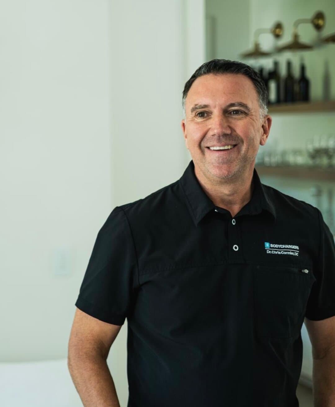 Dr. Chris Cormier wearing his BodyChargers polo